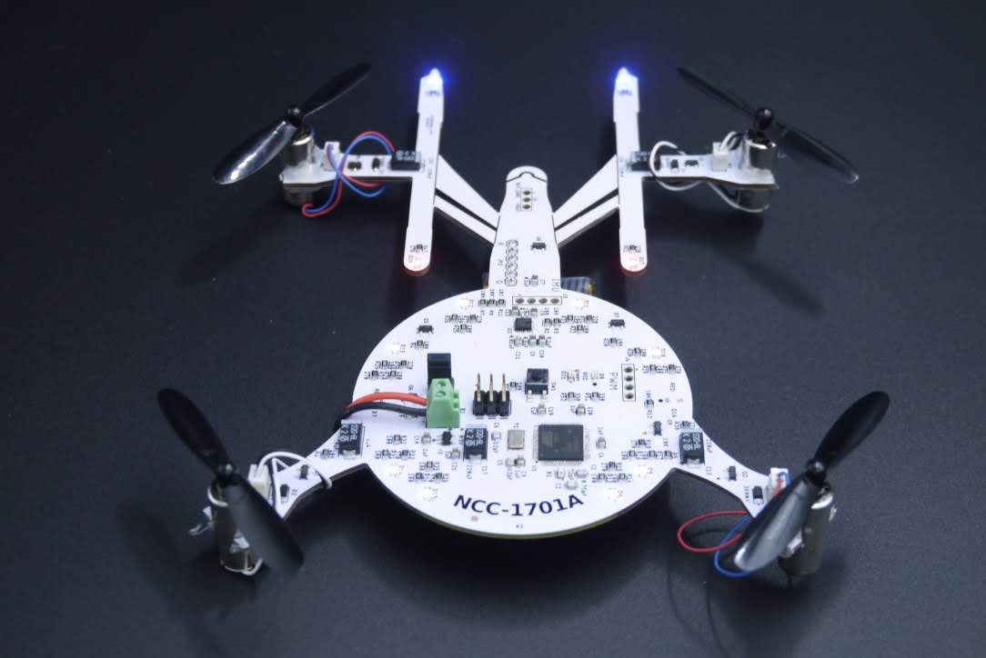 Quadcopter in the shape of the Starship Enterprise on a black background
